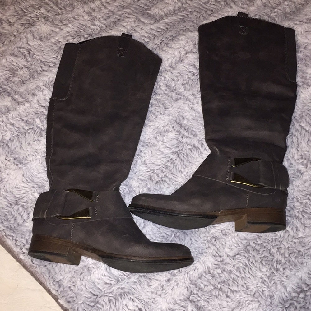 Grey boots a little below the knee